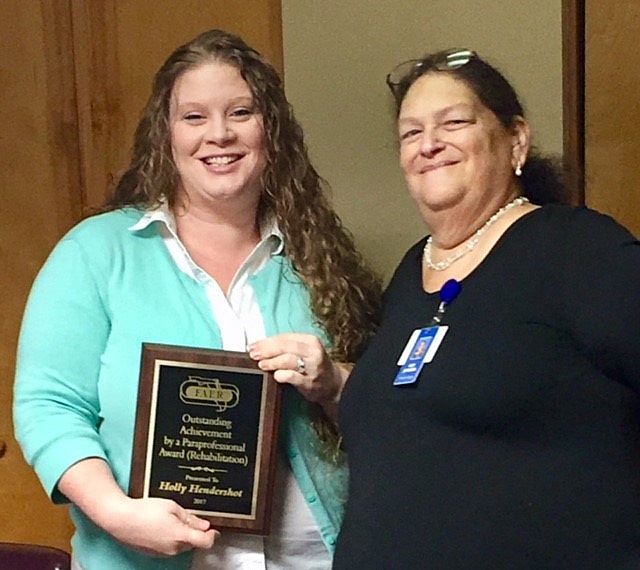 Rehab Tech Holly Hendershot being presented with the FAER Outstanding Paraprofessional Achievement Award.